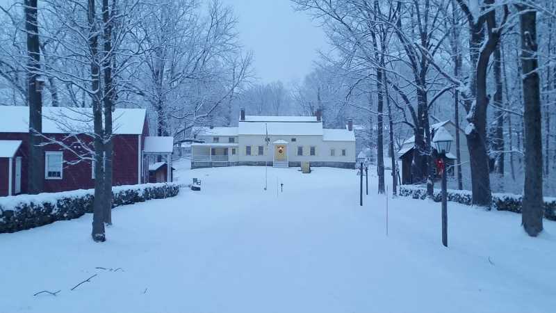                         The Brinckerhoff House and other buildings on the property under a blanket of snow.
                        
