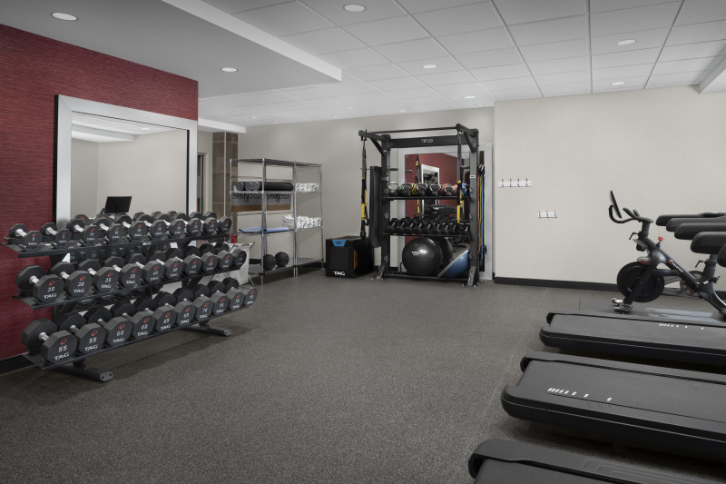                         The fitness center at Home2 Suites with treadmills, hand-weights and other exercise equipment.
                        