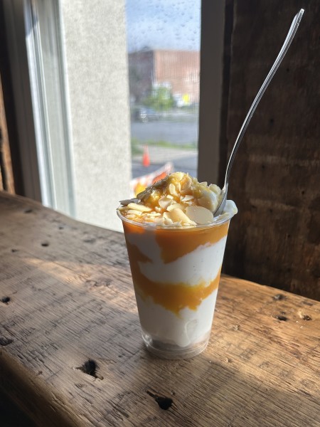                         A sundae in a tall clear cup with a spoon at Barbara's
                        