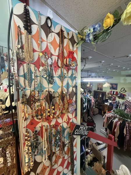                         Inside Red Hook Yard Sale with racks of vintage clothing
                        