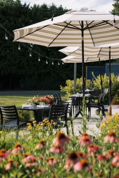                        Outdoor seating at The Grove Restaurant & Bar at Red Hook Golf Club
                        