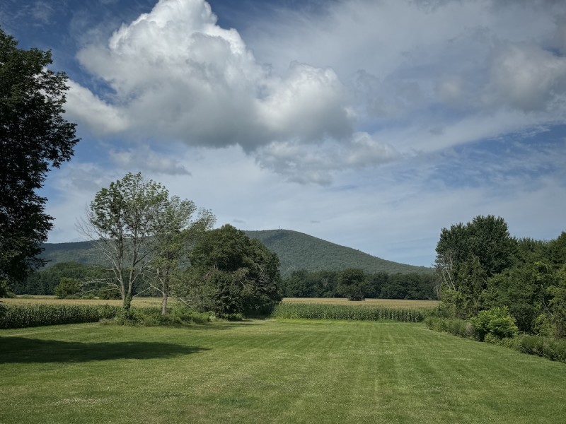                         View of Mountain and scenic cloudy sky from flat plain
                        