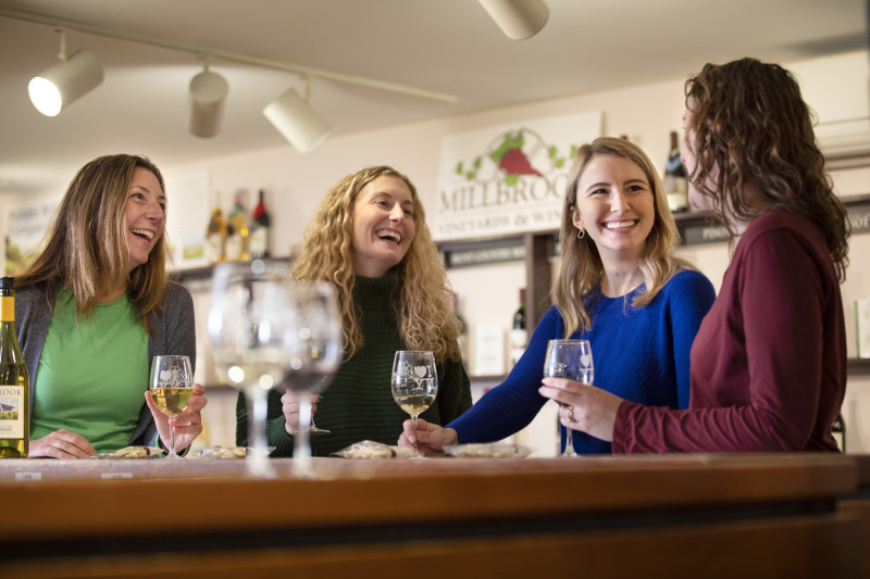                         women in the wine tasting room
                        