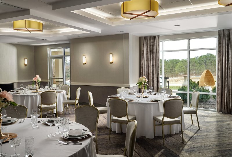                         A view of the event space at the Inn at Bellefield decorated for a wedding reception.
                        