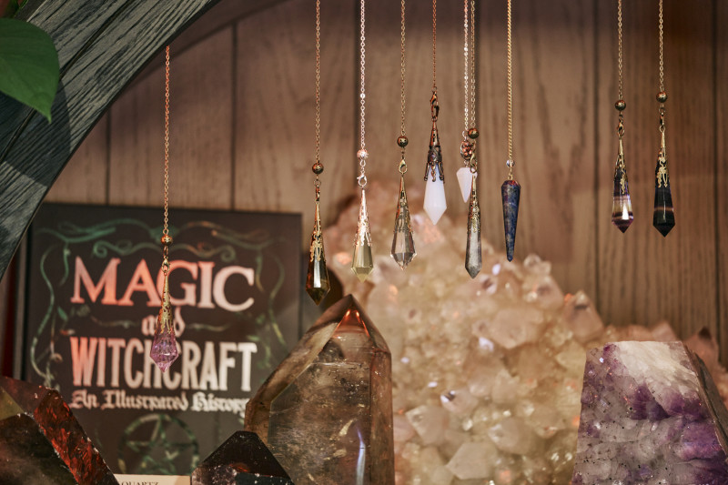                         Crystal necklaces on display.
                        