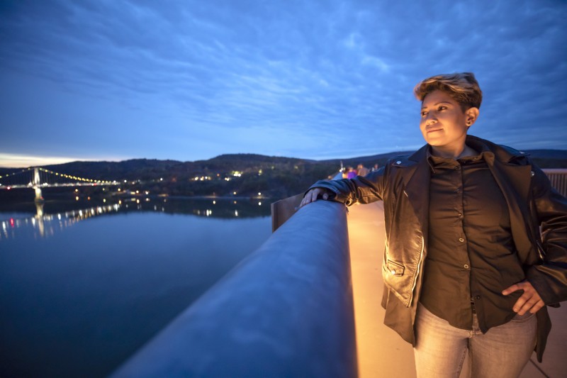                         Woman on the Walkway Over the Hudson State Historic Site at night, Poughkeepsie, NY.
                        