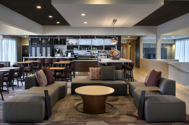                         The lobby of the Courtyard by Marriott Poughkeepsie with sofas and tables.
                        