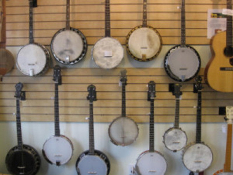                         Banjos and guitars on display at Main Street Music in Beacon.
                        