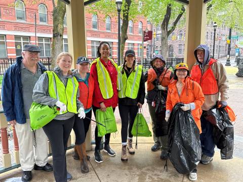 A group posing outside while volunteering for Pick Up The Poconos