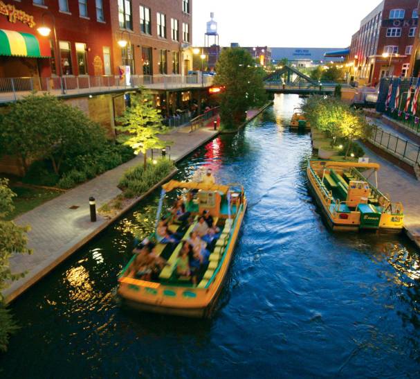 Group riding water taxi along the Bricktown Canal