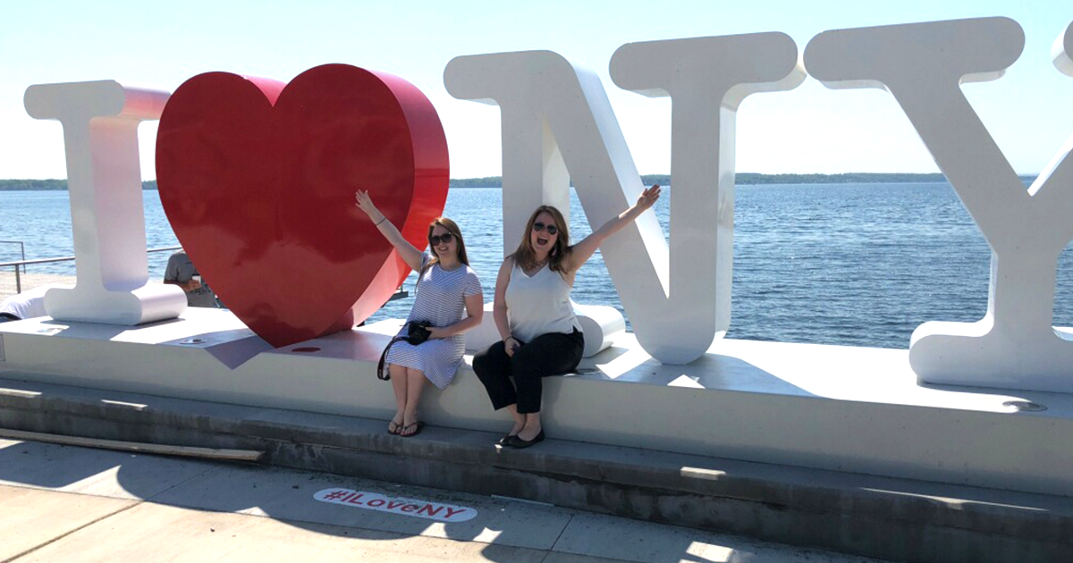 A large I (heart-shaped) Love NY sign stands along Seneca Lake