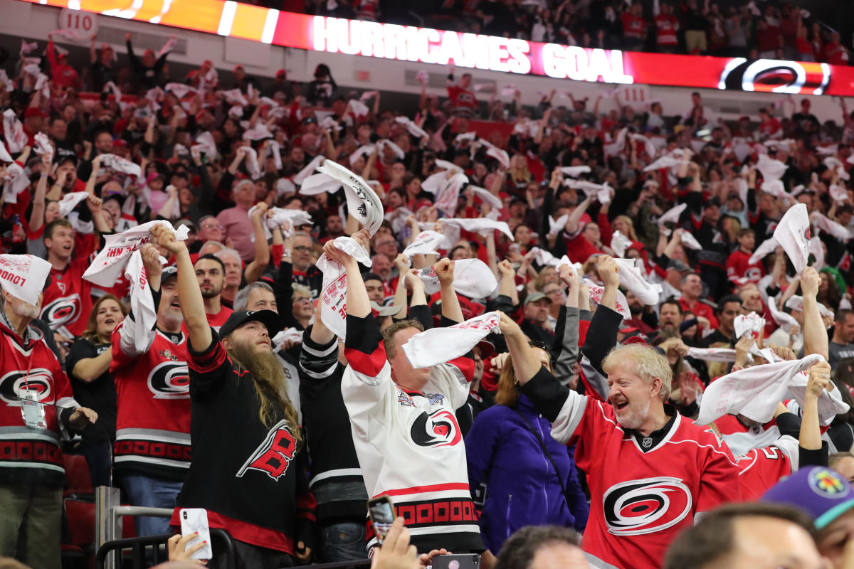 Carolina Hurricanes wear golf outfits to outdoor hockey game