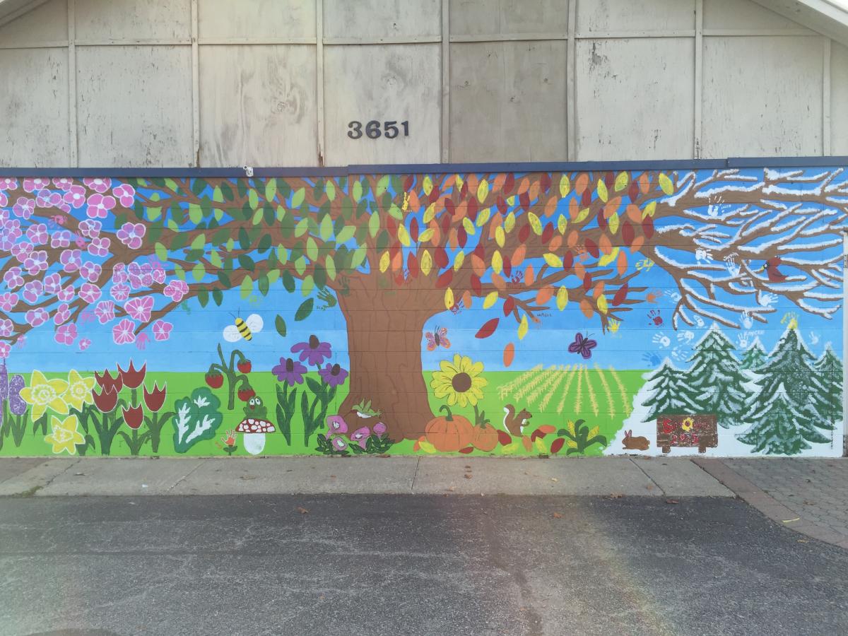 Four seasons mural with tree and seasonal elements
