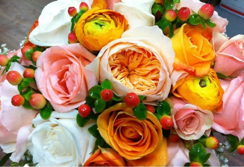 Basket of Orange Ranunculus in Pink
