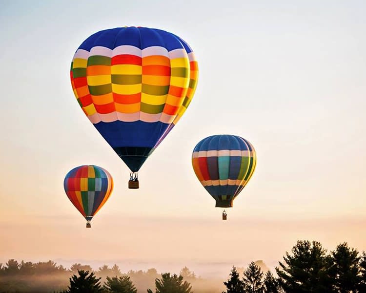 Colorful hot air balloons soaring at the St George Hot Air Balloon Festival 2025