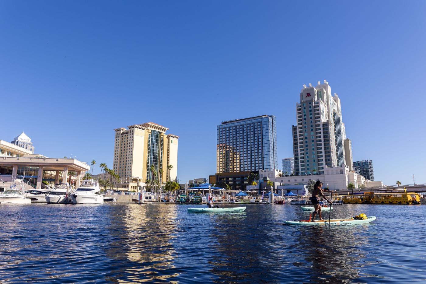 Paddleboard in front of Tampa skyline