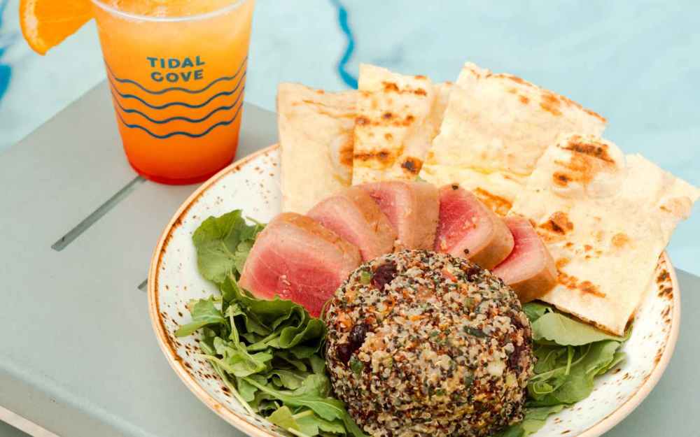 The Baby Kale Power Salad is enriched with succulent seared tuna and vibrant baby kale. A healthy indulgence at Freestyle!