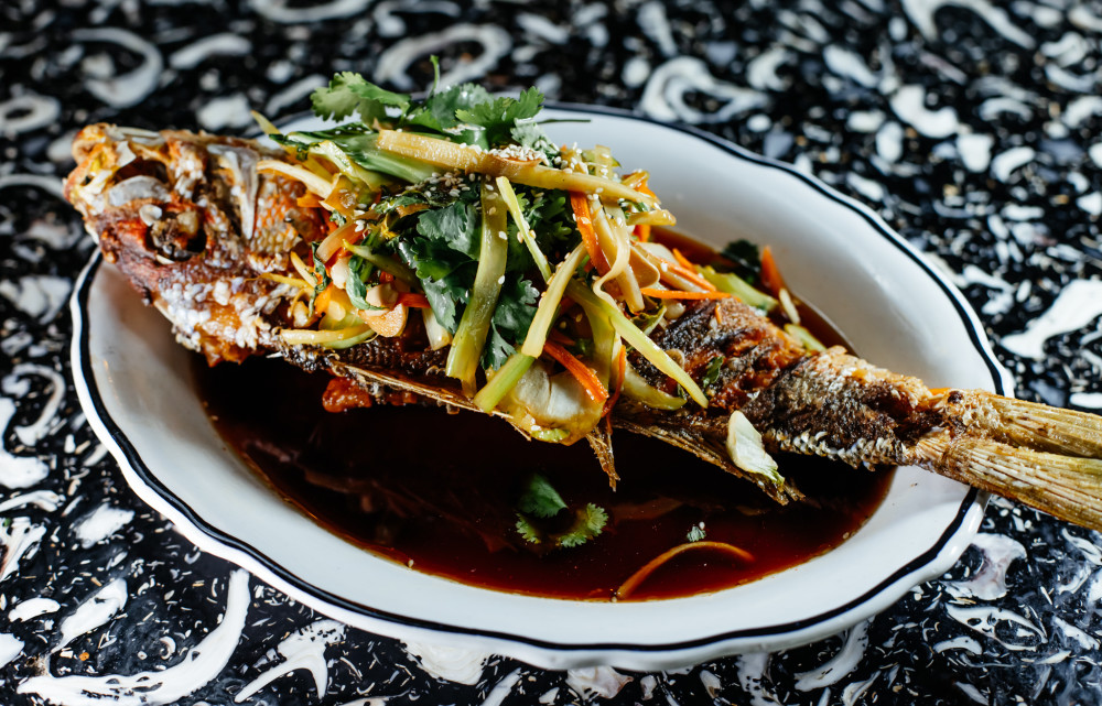Whole-fried Yellowtail Snapper Chinese-Style with soy-citrus-sesame vegetables.