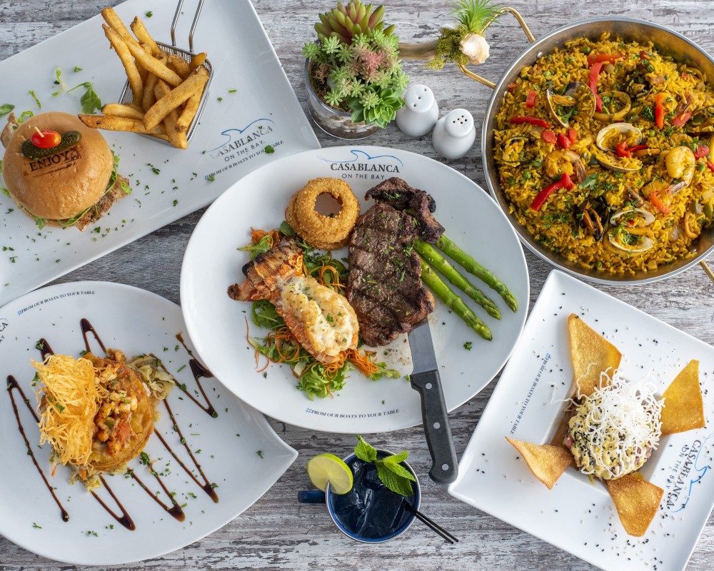 Algunos de nuestros platos más vendidos en Casablanca on the Bay con Surf & Turf, Paella, Tartar de Atún, Tostones de Camarón