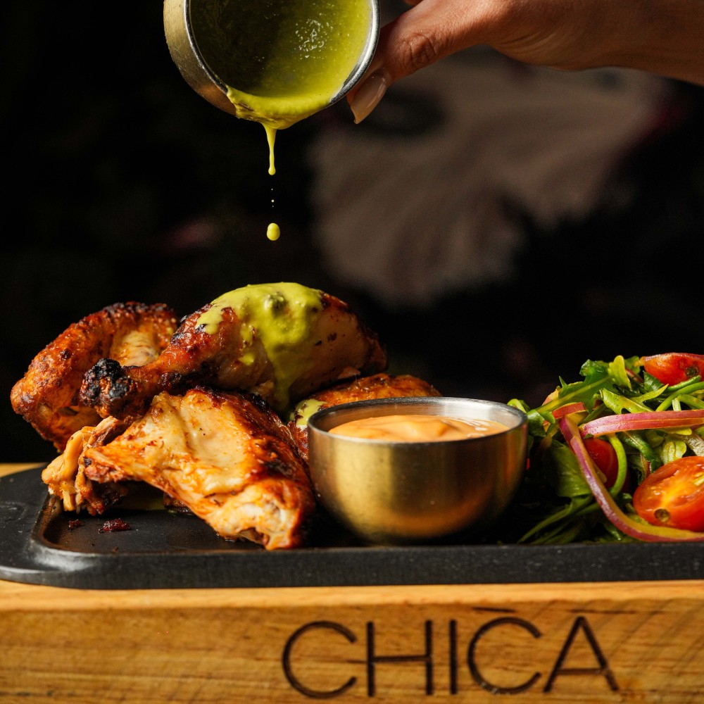 “Pollo a la Brasa” Half Chicken, 
Chintextle Crema, Creamy Avocado Ají Sauce