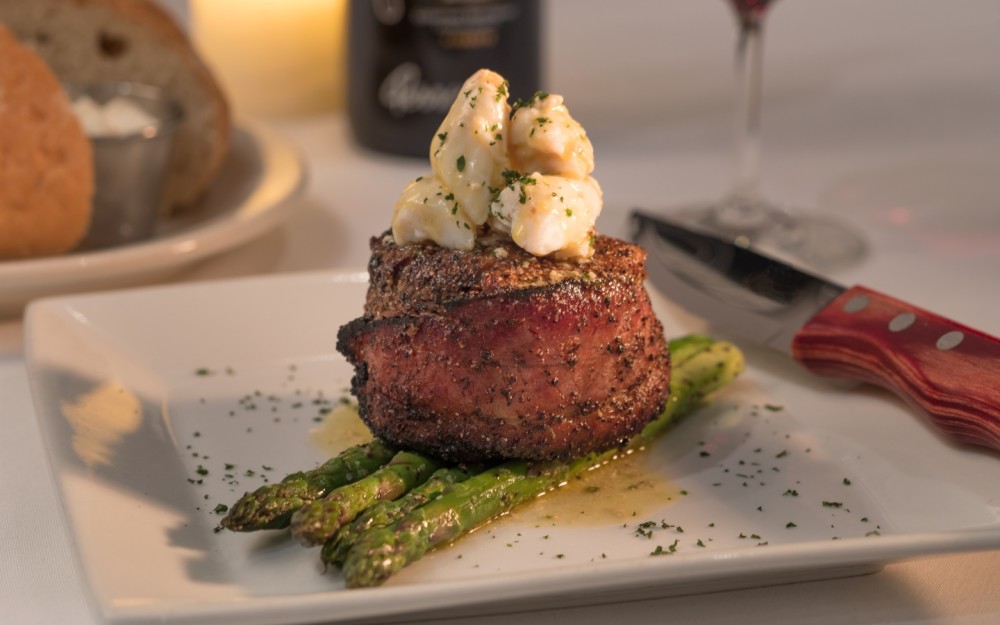 Wrapped in applewood-smoked bacon, topped with jumbo lump crabmeat and Perry's Signature Steak Butter, served with asparagus