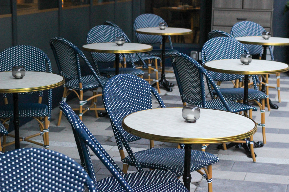 Relaxed outdoor seating in front of Brasserie Laurel.