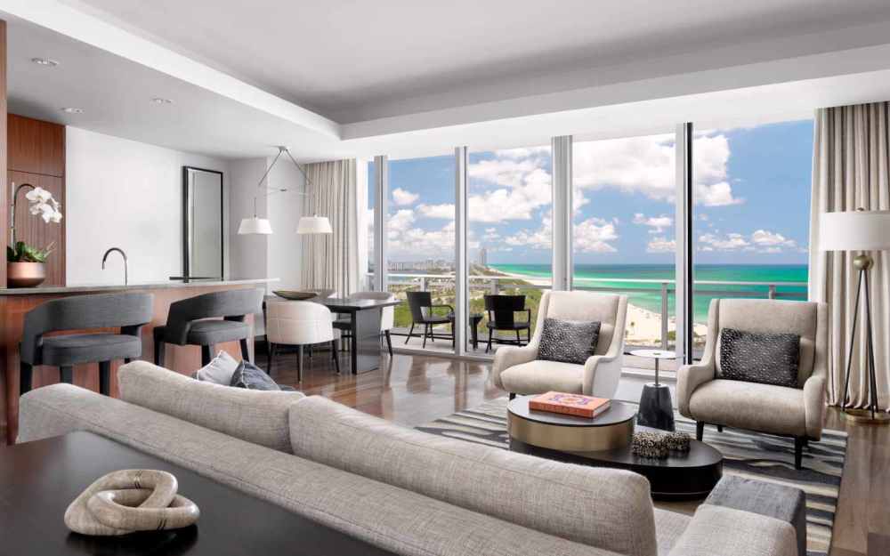 Spacious suites feature two balconies, one and a half baths, a kitchen, a dining area and a living room.