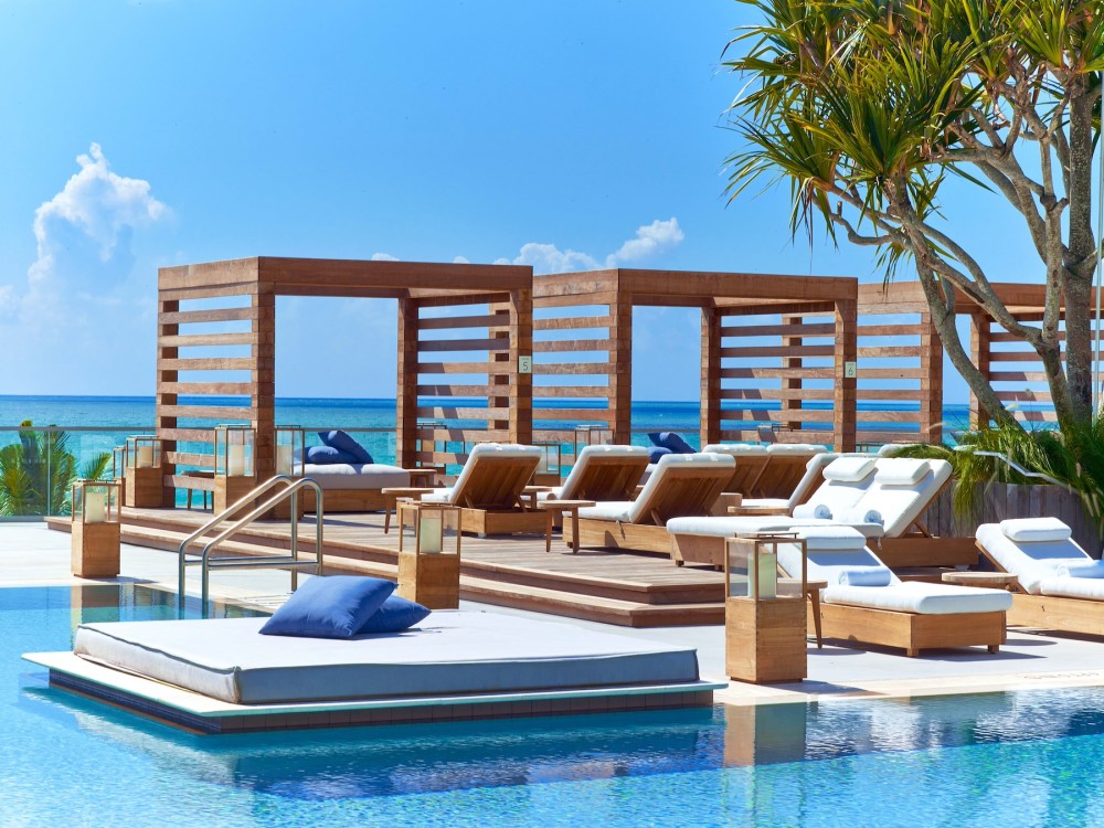 Dune Cabanas at the Center Pool have all the ingredients for a perfect day - daybeds, cool interiors and 180-degree ocean views.