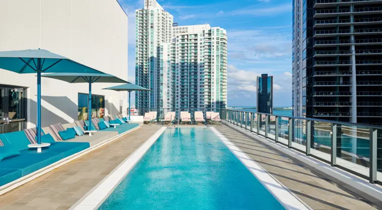 The rooftop bar is on the top floor of the Miami Brickell hotel and is open for hotel guests and locals. The rooftop bar is open from 12PM to 10PM daily. The rooftop pool is open from sunrise to sunset daily and is an amenity only for the use of hotel guests (no public access).