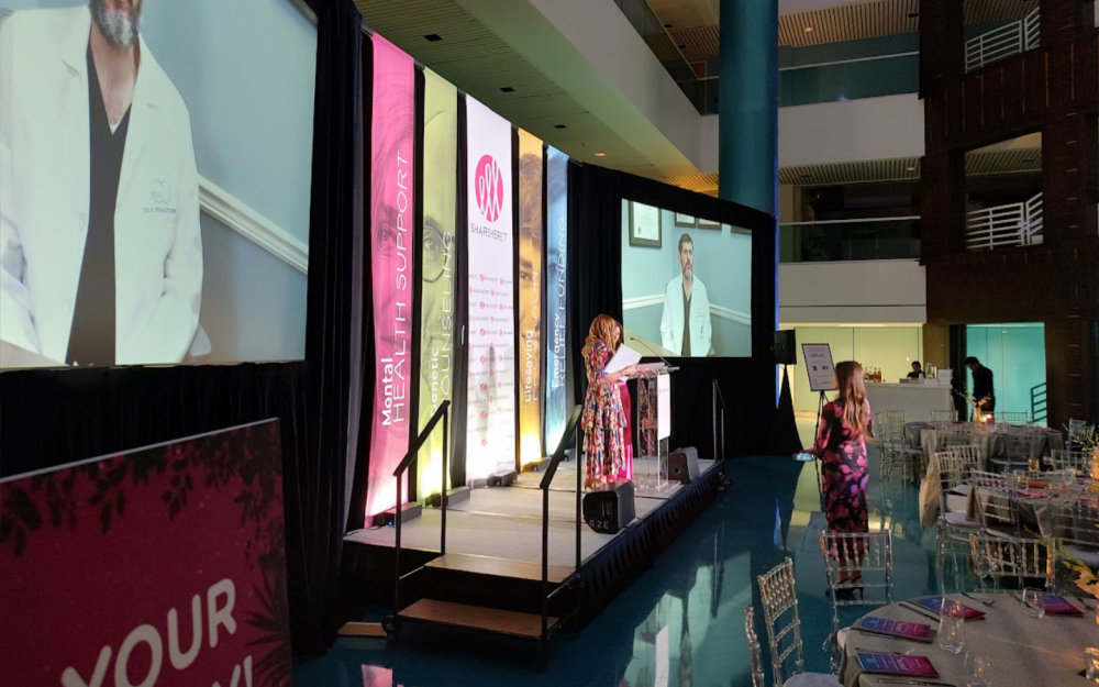 2 screen show, side view of stage