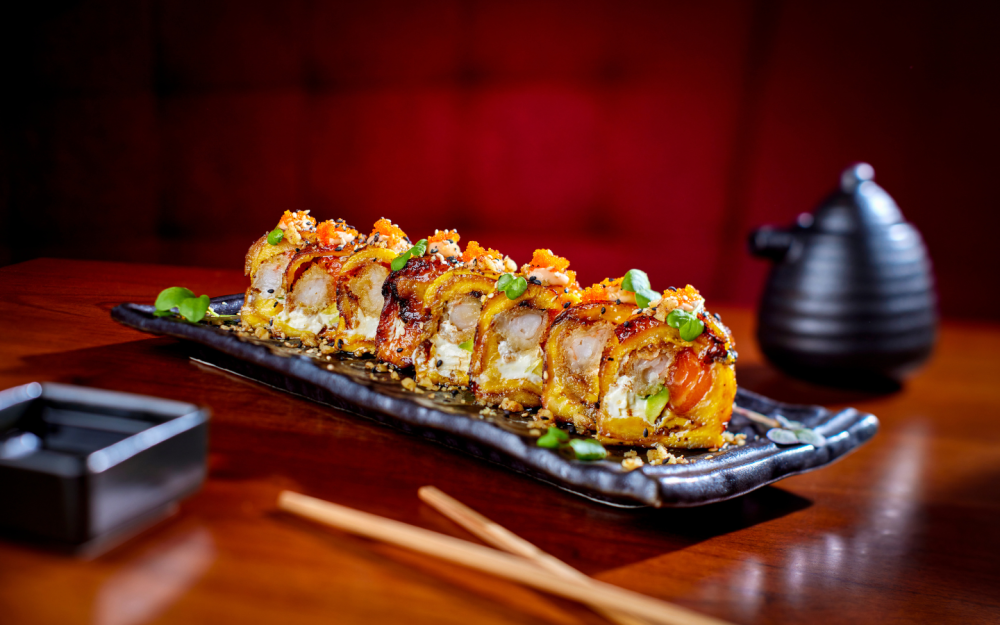 Rice-less wrapped in sweet plantain, cream cheese, avocado, salmon, tempura shrimp. Topped with spicy mayo and walnuts.