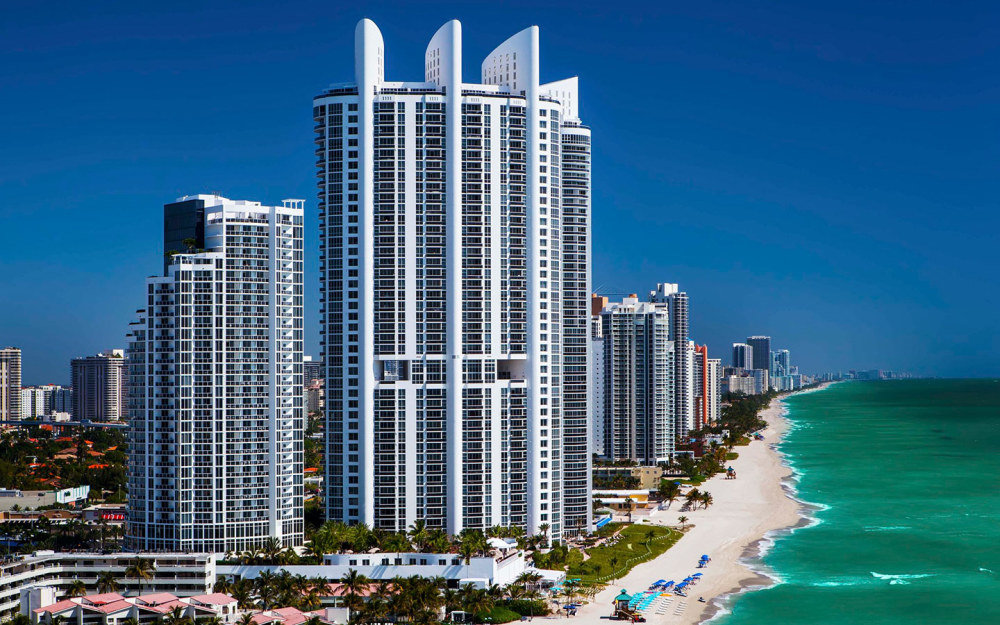 Views of building and beach at Trump International Beach Resort Miami.