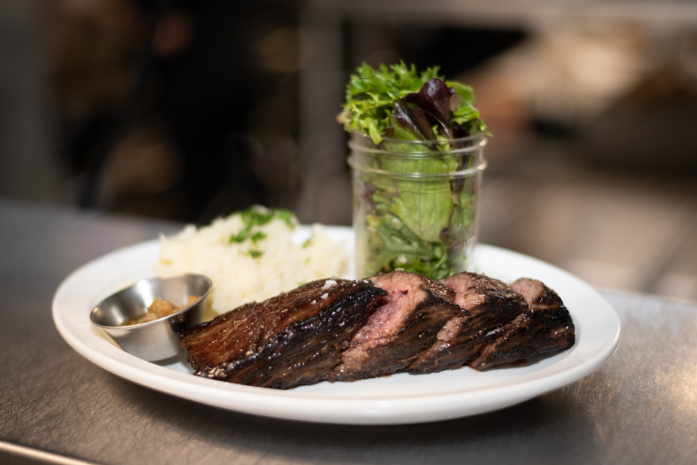 Grilled Prime Flap Steak 9oz. served with truffle mashed potatoes and mixed greens