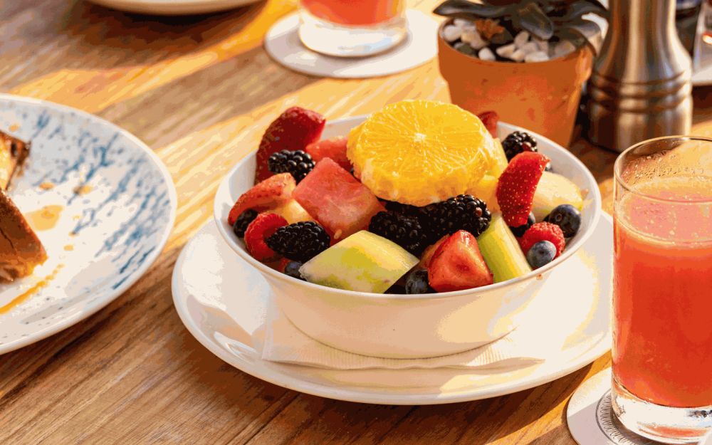 Freshness in every bite: Market Fruit Bowl with watermelon, orange, melon, pineapple, and berries.