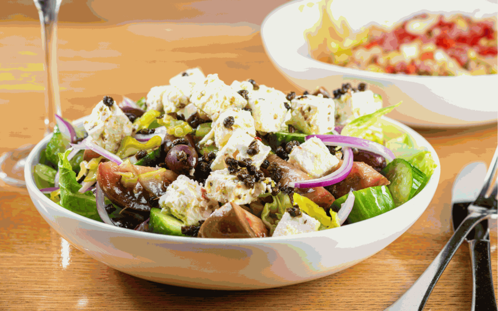 Experience the taste of freshness with the Greek Salad. Crisp, vibrant, and bursting with Mediterranean flavors.