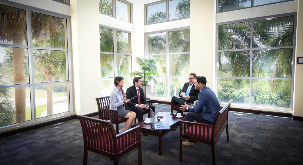 Professionals meeting in second floor alcove