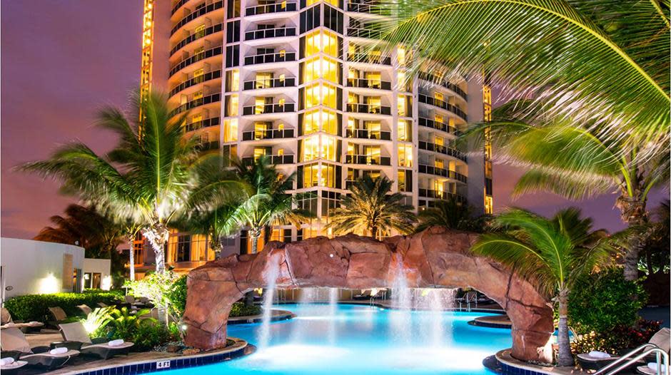 Outdoor pool and building at Trump International Beach Resort.