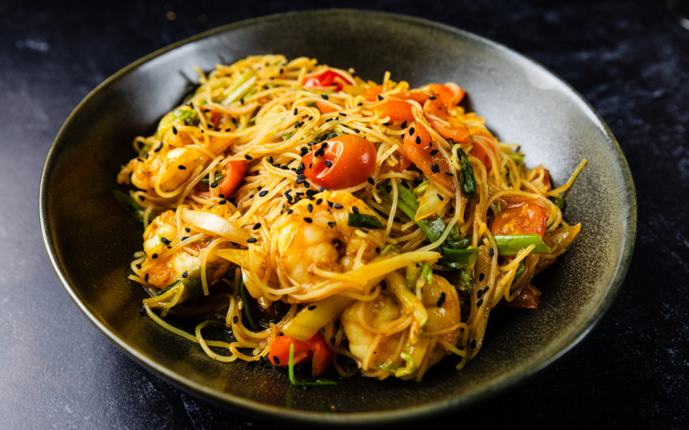 Thin rice noodles stir-fried with cabbage, turmeric-curry Singapore sauce, and a hint of Shiraz. Served with your choice of chicken or shrimp.