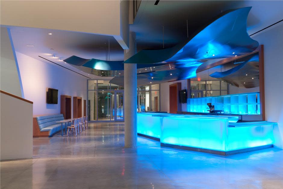Atrium Featuring Frank Gehry Designed Luminescent Bar Photo by Claudia Uribe