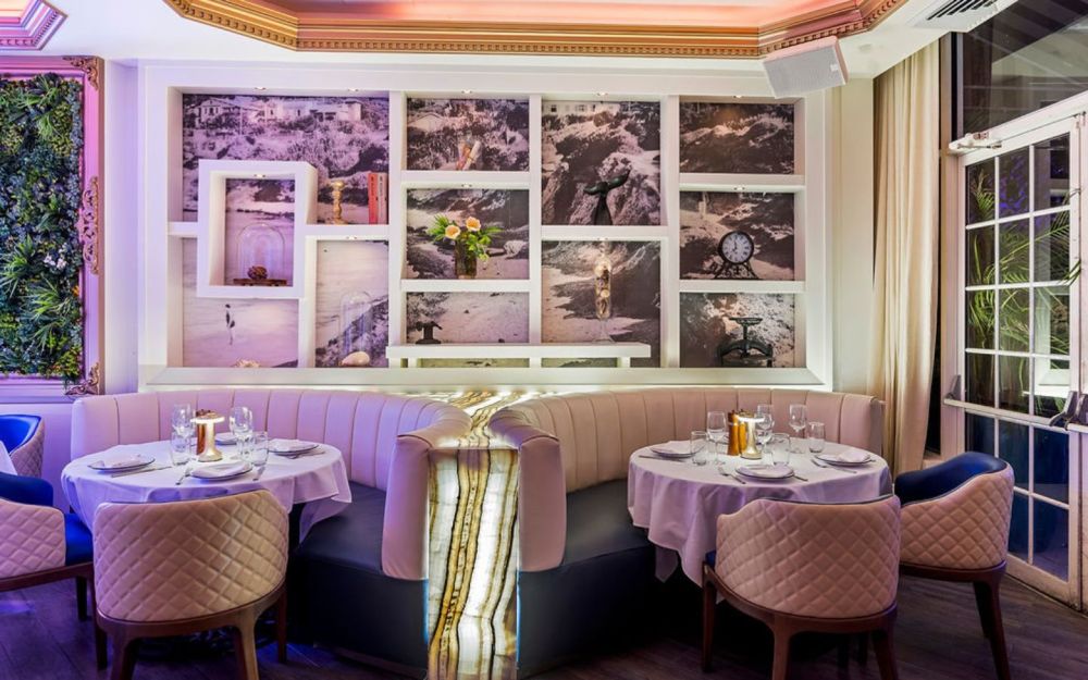 Circular booth area and its enlightened rainbow onyx in the main dining rom.