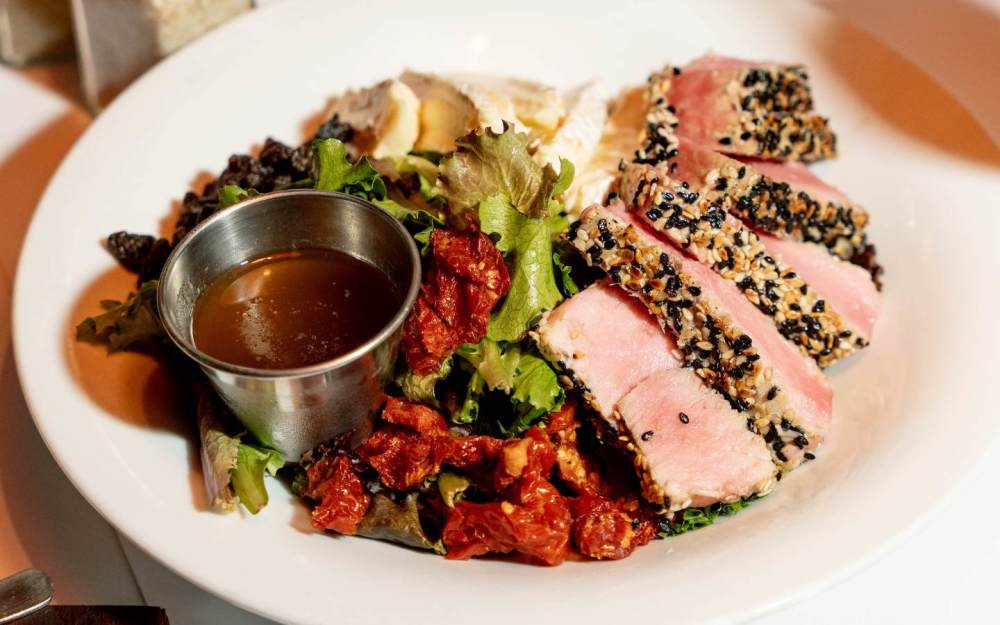 Served with mixed greens, brie cheese, and sun dried tomatoes