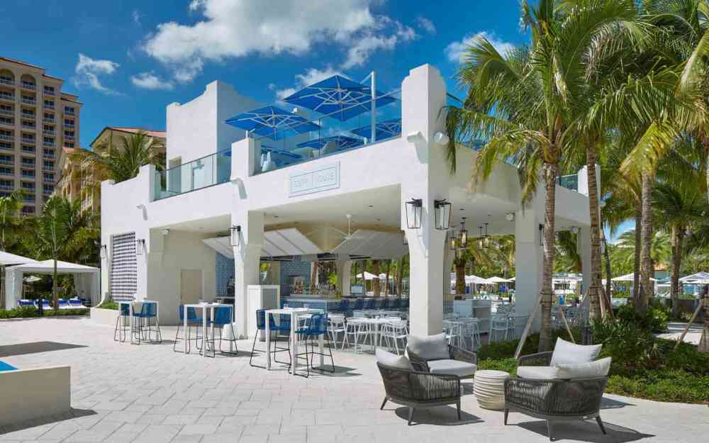 Welcome to Surf House! Lively ambiance, triple wave views by the FlowRider. Enjoy island cocktails and drinks at our poolside bar.