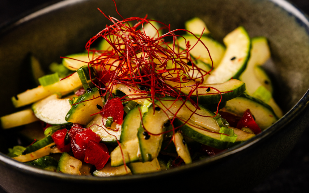 Chilled cucumber in rice vinegar, sesame oil, and pickled ginger.