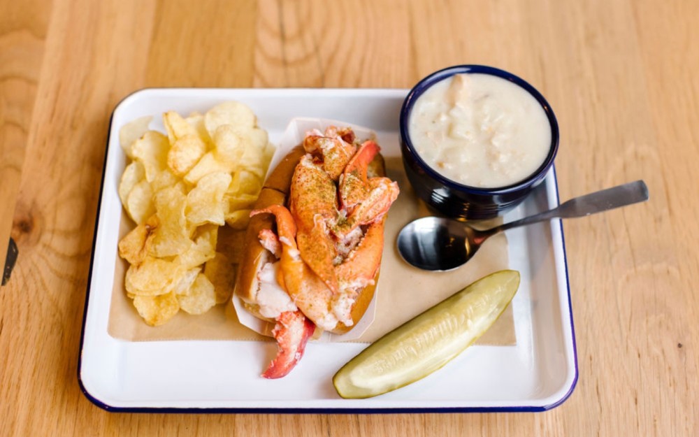 Luke's Lobster Mainer meal with a lobster roll, New England clam chowder, and kettle chips