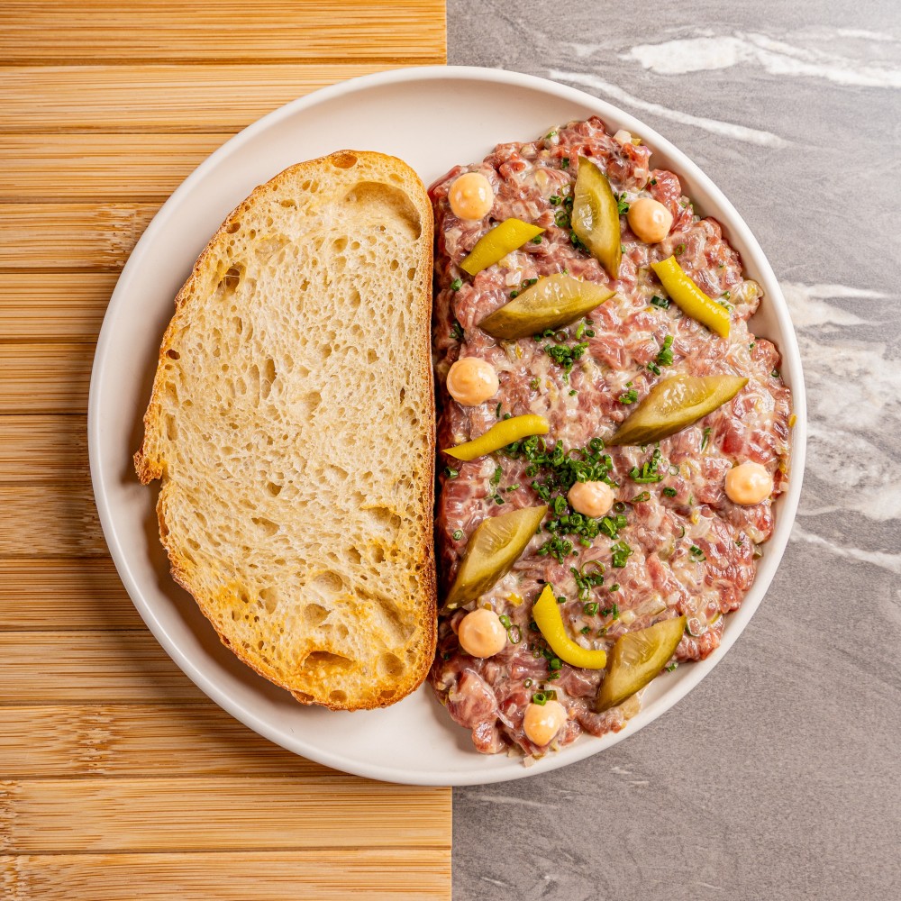 Prime beef, House pickles, Cured egg yolk, Sourdough, Aji Limo, Aioli.