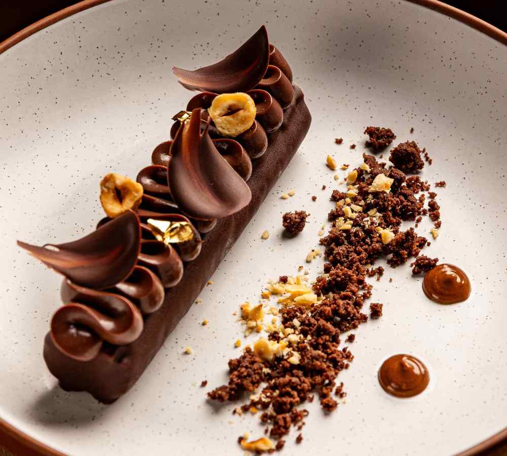 Decadent delight: Five-Spice Chocolate Mousse with salted caramel, sesame crunch & chocolate crumble. A bold twist on indulgence.