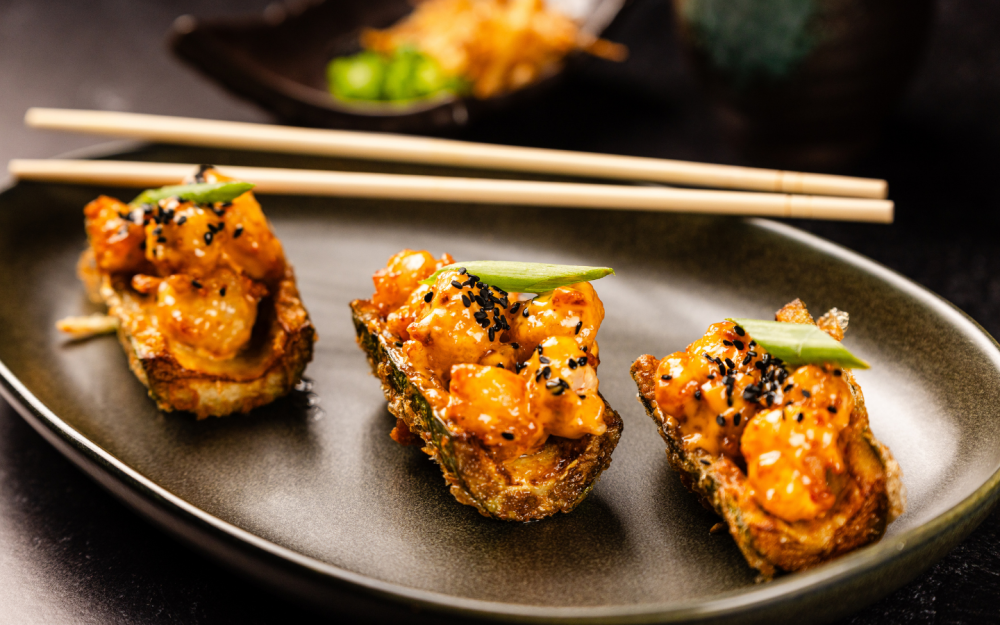 Crispy rock shrimp tempura in a crispy cucumber boat tossed in a spicy-tangy sauce.