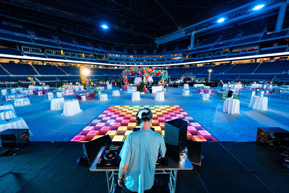 On-field reception and DJ activation under the lights at loanDepot park.