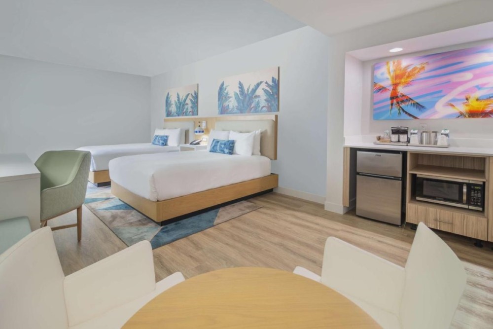 Junior studio with 2 queen beds, sitting area and a microwave