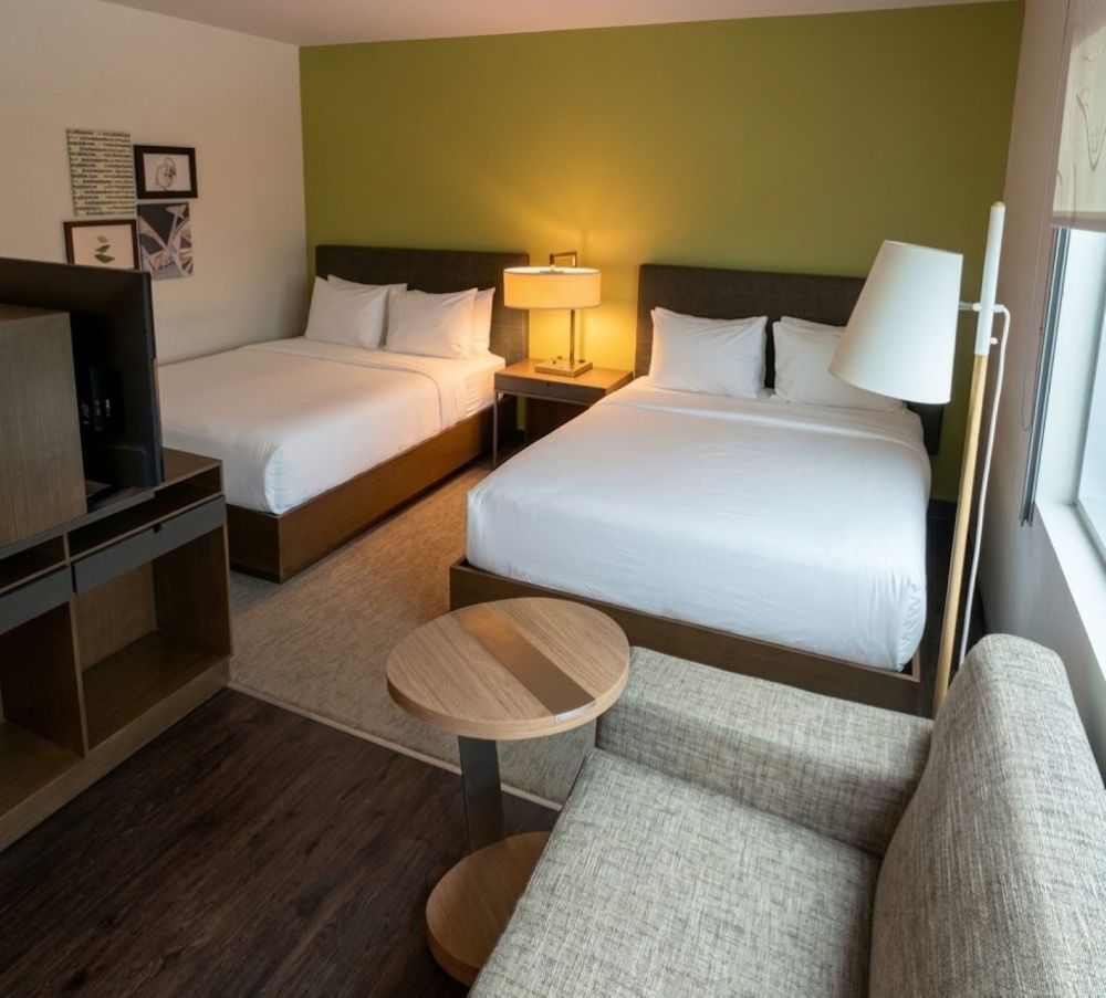Designed for maximum comfort and sustainability, the Double Queen Guest Room features two signature Heavenly® Beds topped with eco-friendly linens.